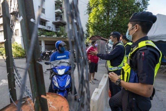 'Total lockdown' in Malaysia to slow pandemic 'Total lockdown' in Malaysia to slow pandemic