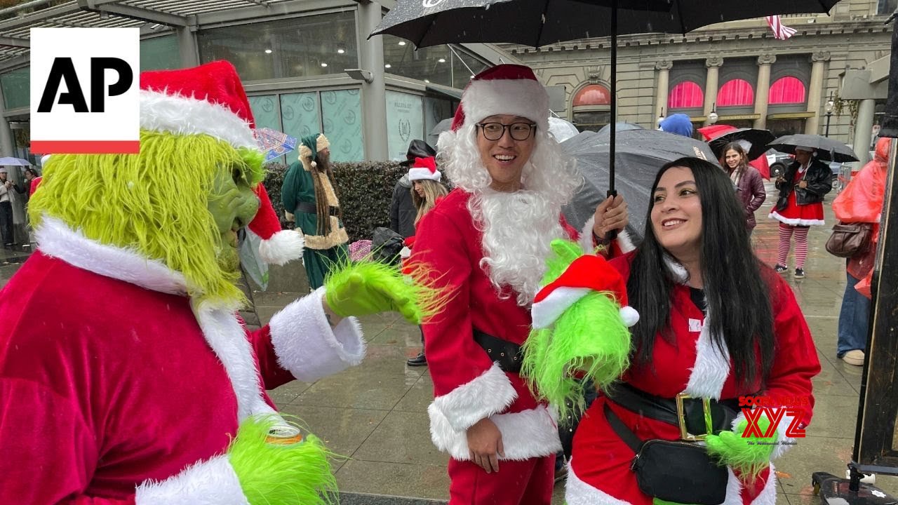 Santas and a few Grinches gather for annual SantaCon bar crawls (Video)