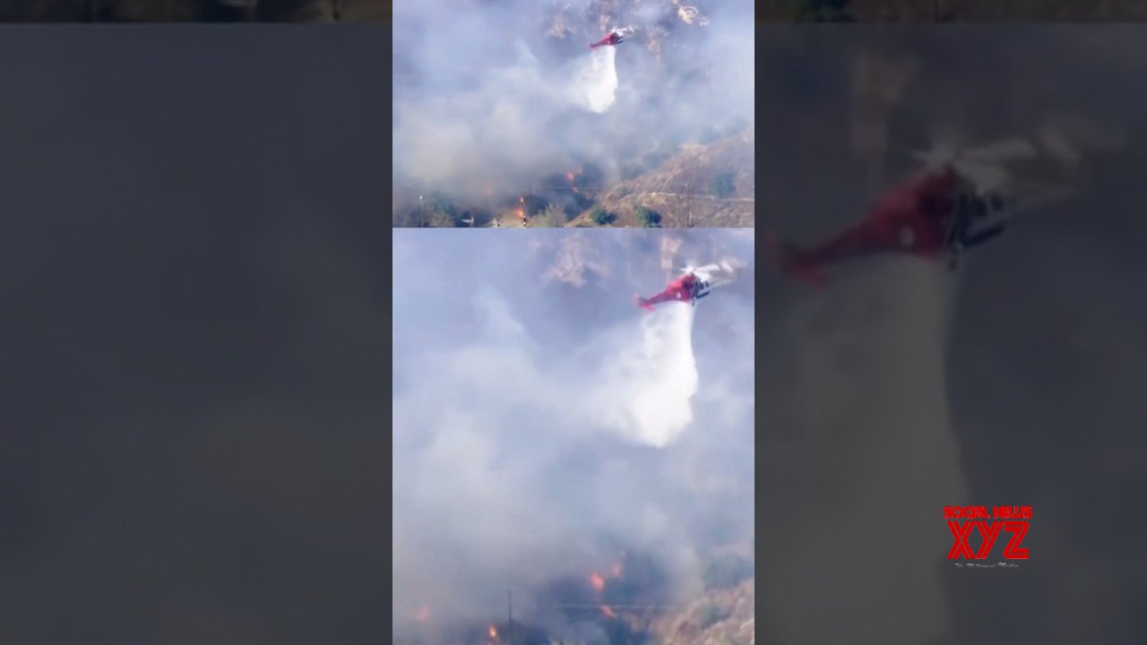 Footage shows a helicopter dropping water on wildfire #shorts (Video)