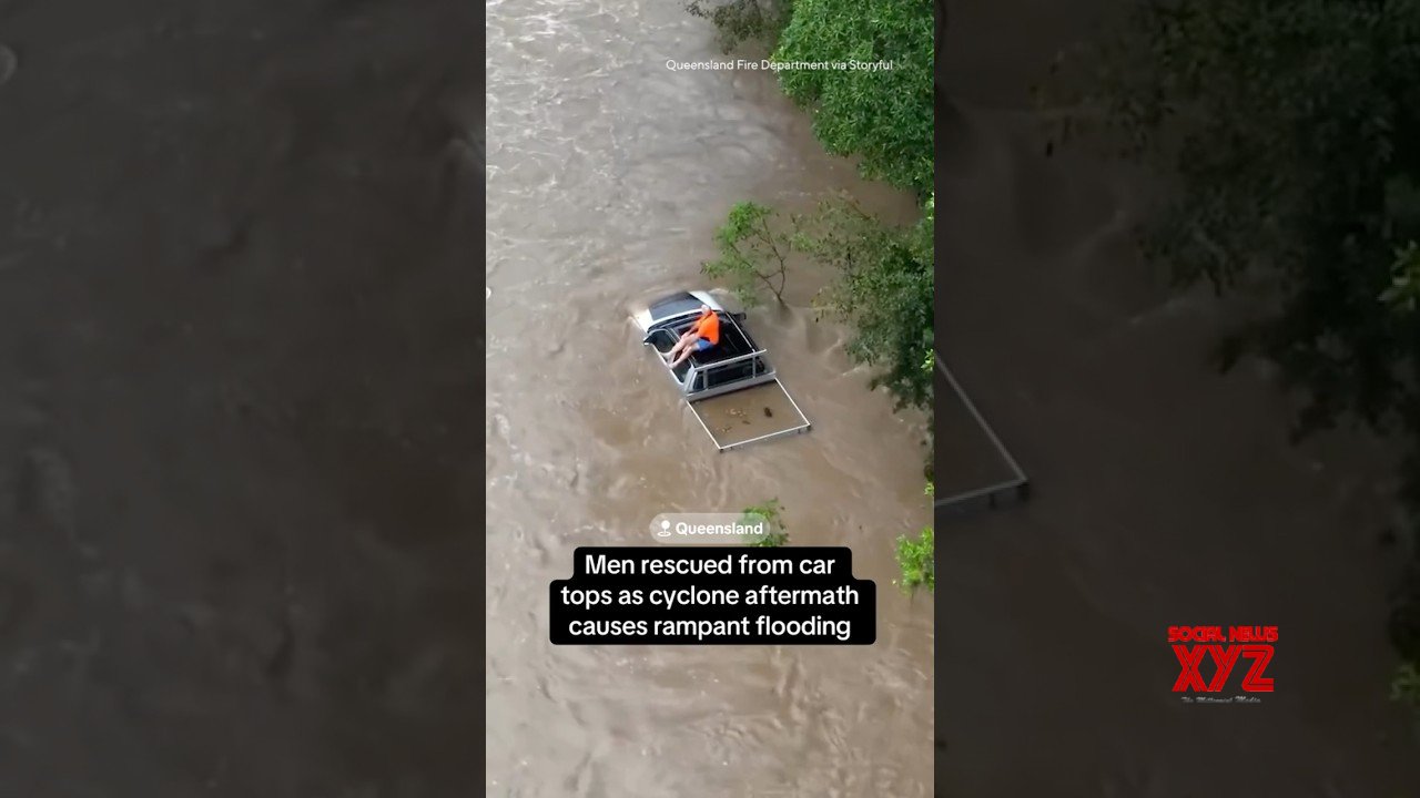 Men rescued from car tops as tropical cyclone causes flooding in Australia #shorts (Video)