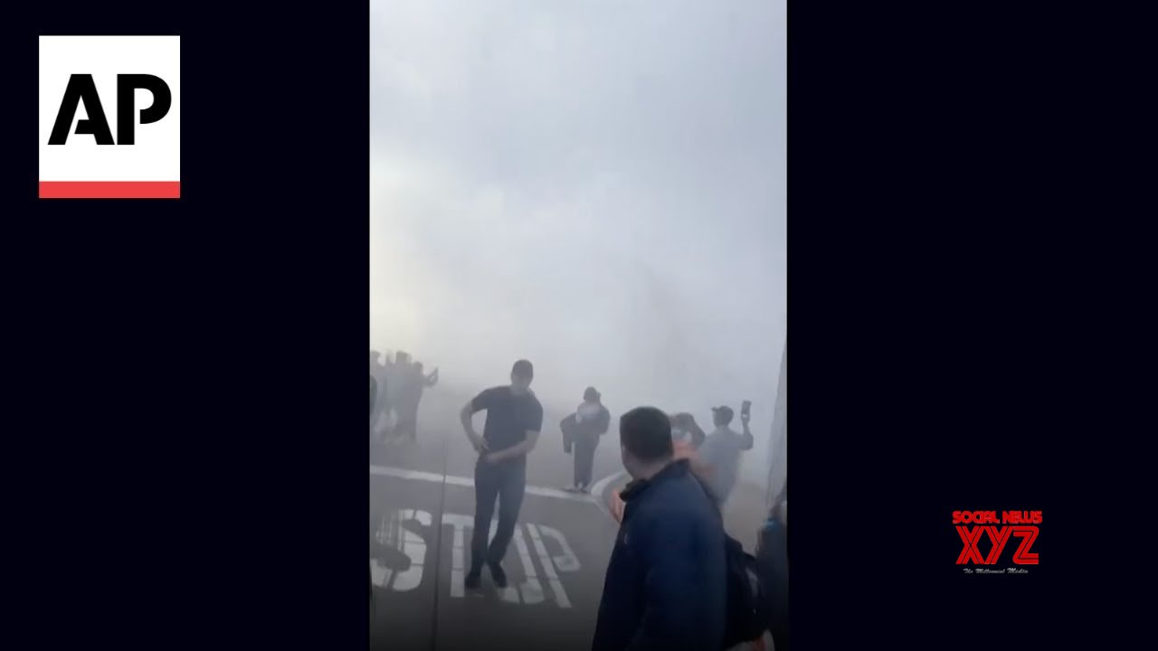 American Airlines plane catches on fire at Denver airport (Video)