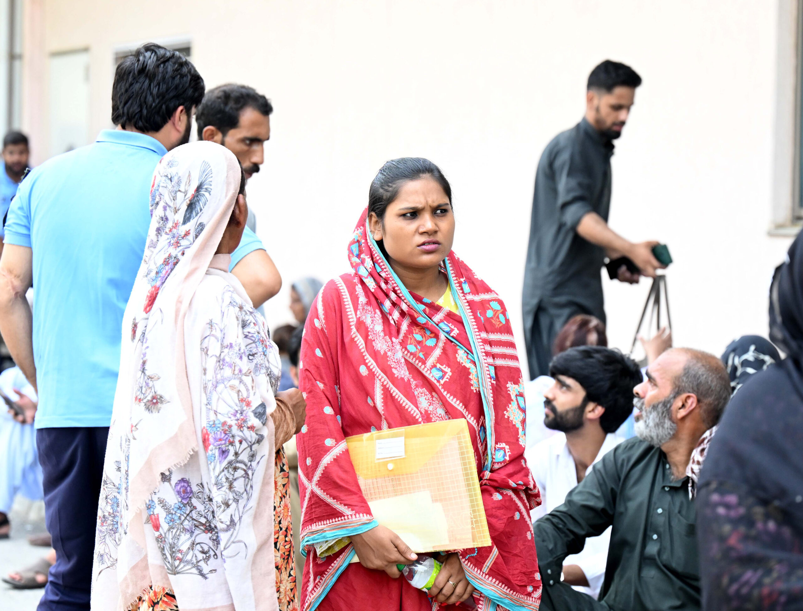 Islamabad: People gather at a hospital following a fire that broke out in the gynecology ward of the Pakistan Institute of Medical Sciences, in Islamabad, Pakistan, on Wednesday, August 26, 2026. At least 14 infants were killed in the incident, according to police sources. (Photo: Xinhua/Ahmad Kamal via IANS)
