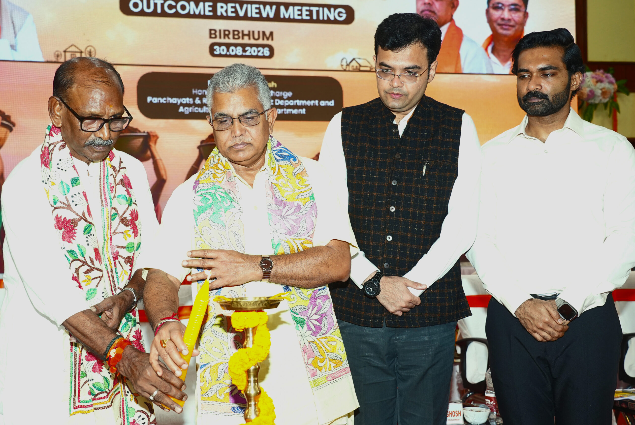 Birbhum: West Bengal Panchayat and Rural Development Minister Dilip Ghosh, along with  West Bengal Agriculture Minister Dudh Kumar Mondal and District Magistrate and Collector Dhaval Jain lights a lamp during a rural development review meeting in Suri, Birbhum district, West Bengal, on  Sunday, August 30, 2026. (Photo: IANS)