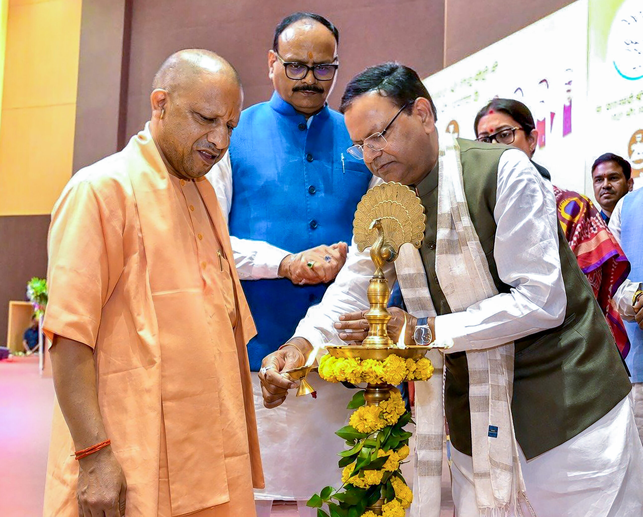 Lucknow: Uttar Pradesh Chief Minister Yogi Adityanath in the presence of Uttar Pradesh BJP President Pankaj Chaudhary and Uttar Pradesh Deputy Chief Minister Brajesh Pathak, lights a ceremonial lamp during the Seva Sankalp Abhiyan programme in Lucknow on Monday, August 31, 2026. (Photo: IANS/X/@mppchaudhary)