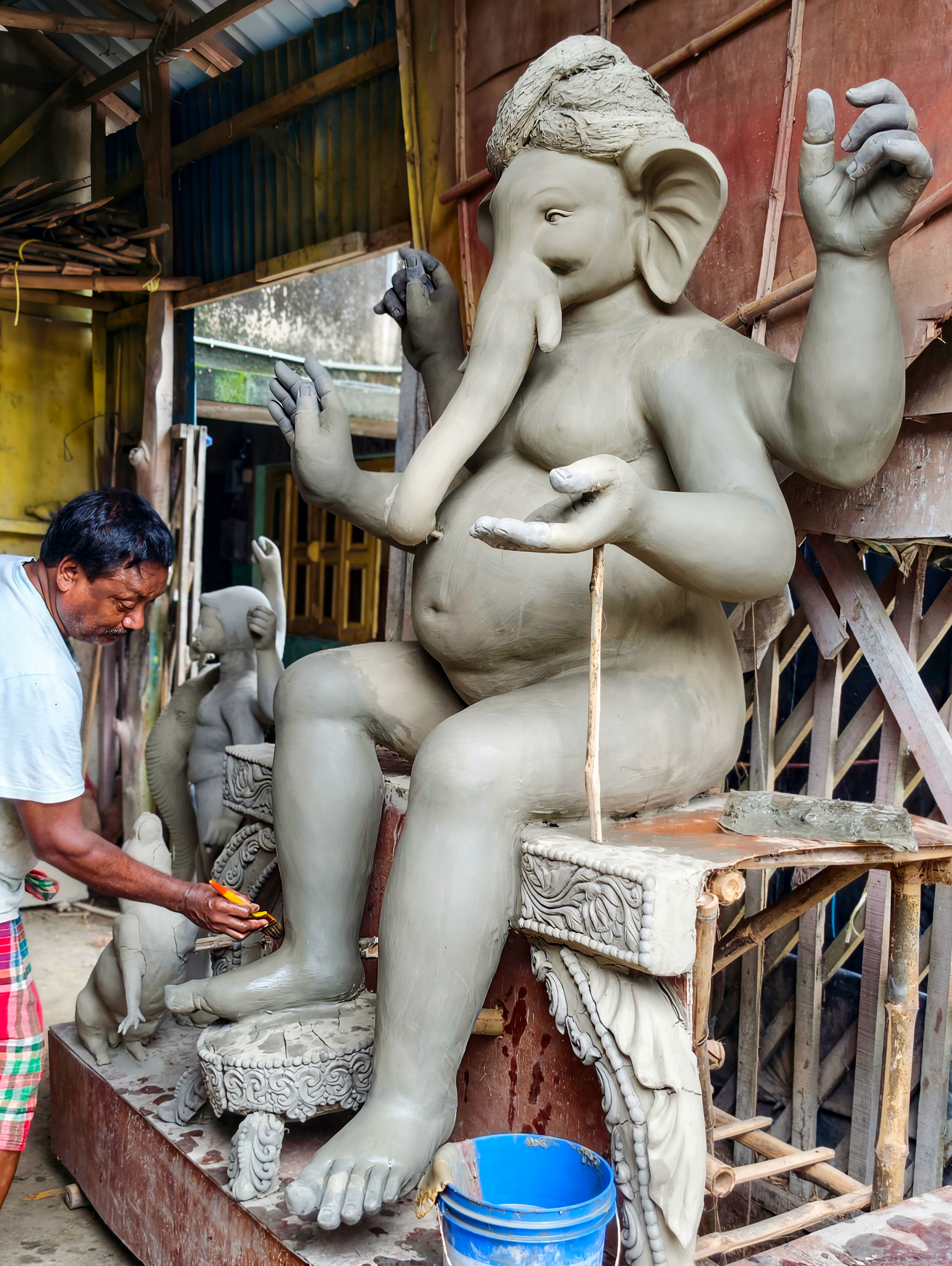 Haldia: An artisan crafts a massive idol of Lord Ganesha at the Kumartuli neighbourhood of Durgachak, ahead of the Ganesh Chaturthi festival, in Haldia, East Medinipur district, West Bengal, on Tuesday, September 8, 2026. (Photo: IANS)