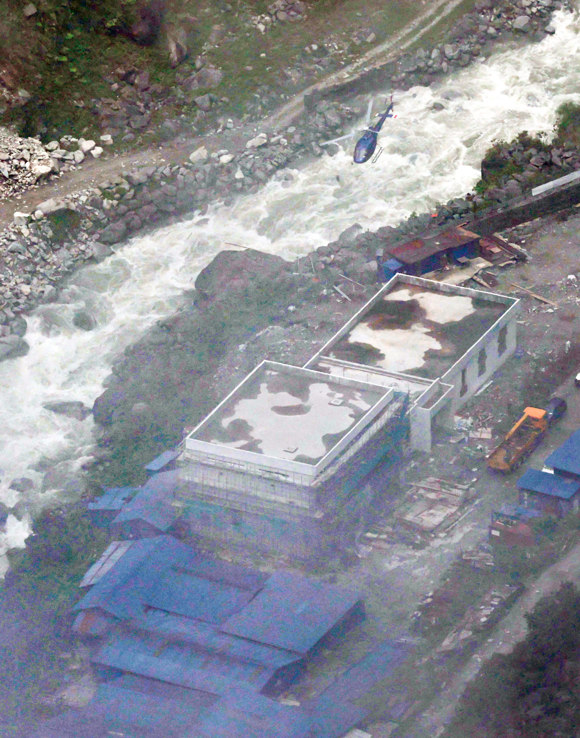 Rasuwa: A helicopter is seen at the Upper Trishuli-1 hydropower plant construction site in Nepal's Rasuwa district on Sept. 3, 2026, as members of a South Korean disaster relief team conduct search and rescue operations for victims, including nine South Koreans, who remain unaccounted for, following devastating floods in Nepal. (Photo: Yonhap via IANS)