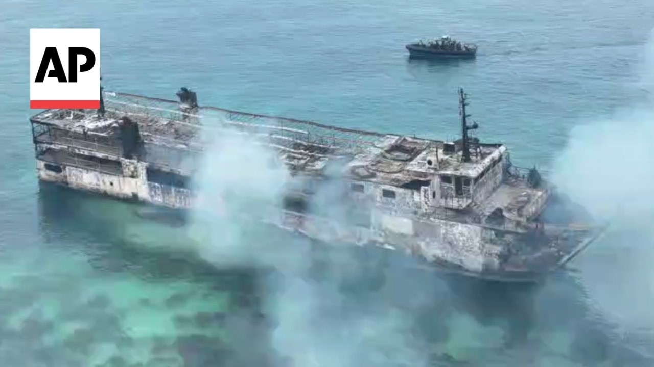 Smoldering remains of Philippine ferry after fire kills 5 with dozens missing (Video)