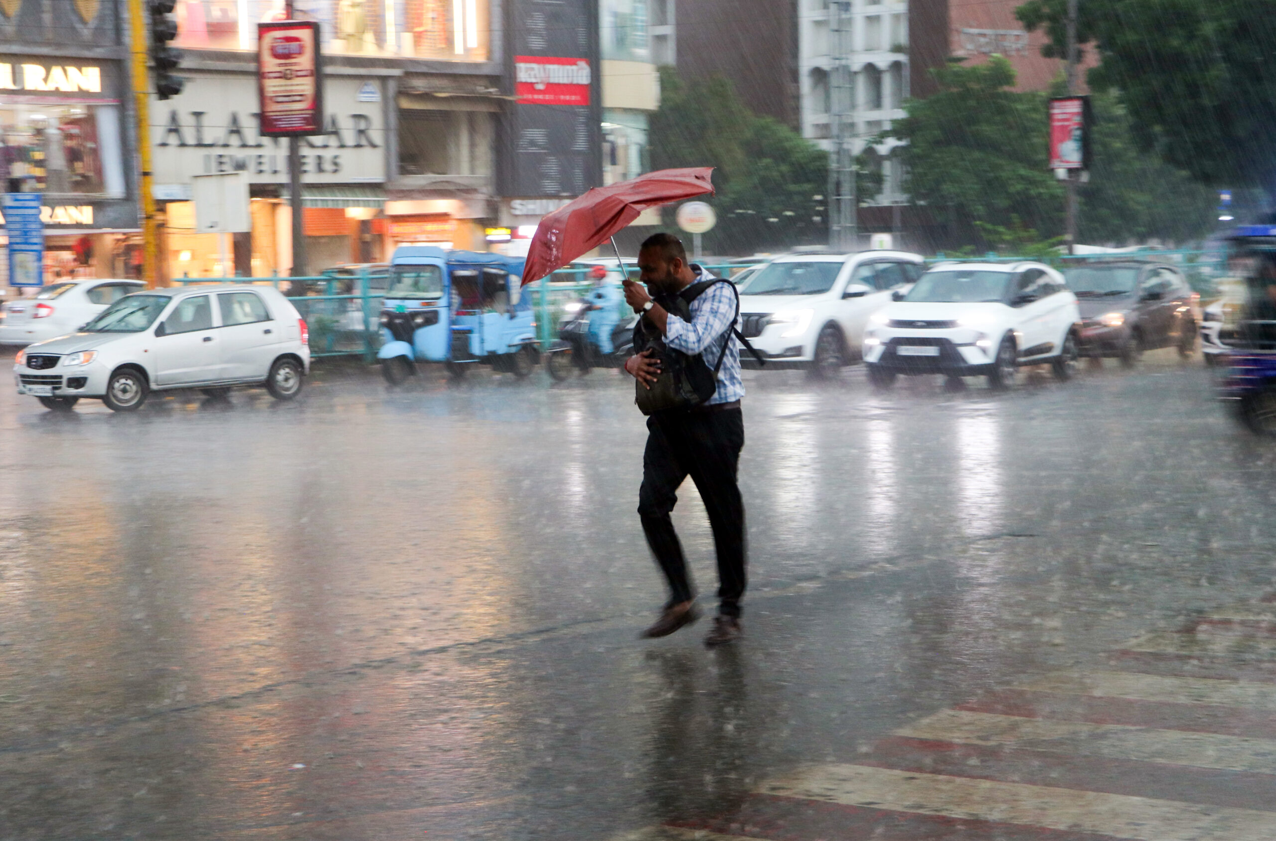 Bhopal: A man walks with an umbrella amid heavy rainfall in Bhopal on Friday, September 11, 2026. (Photo: IANS)
