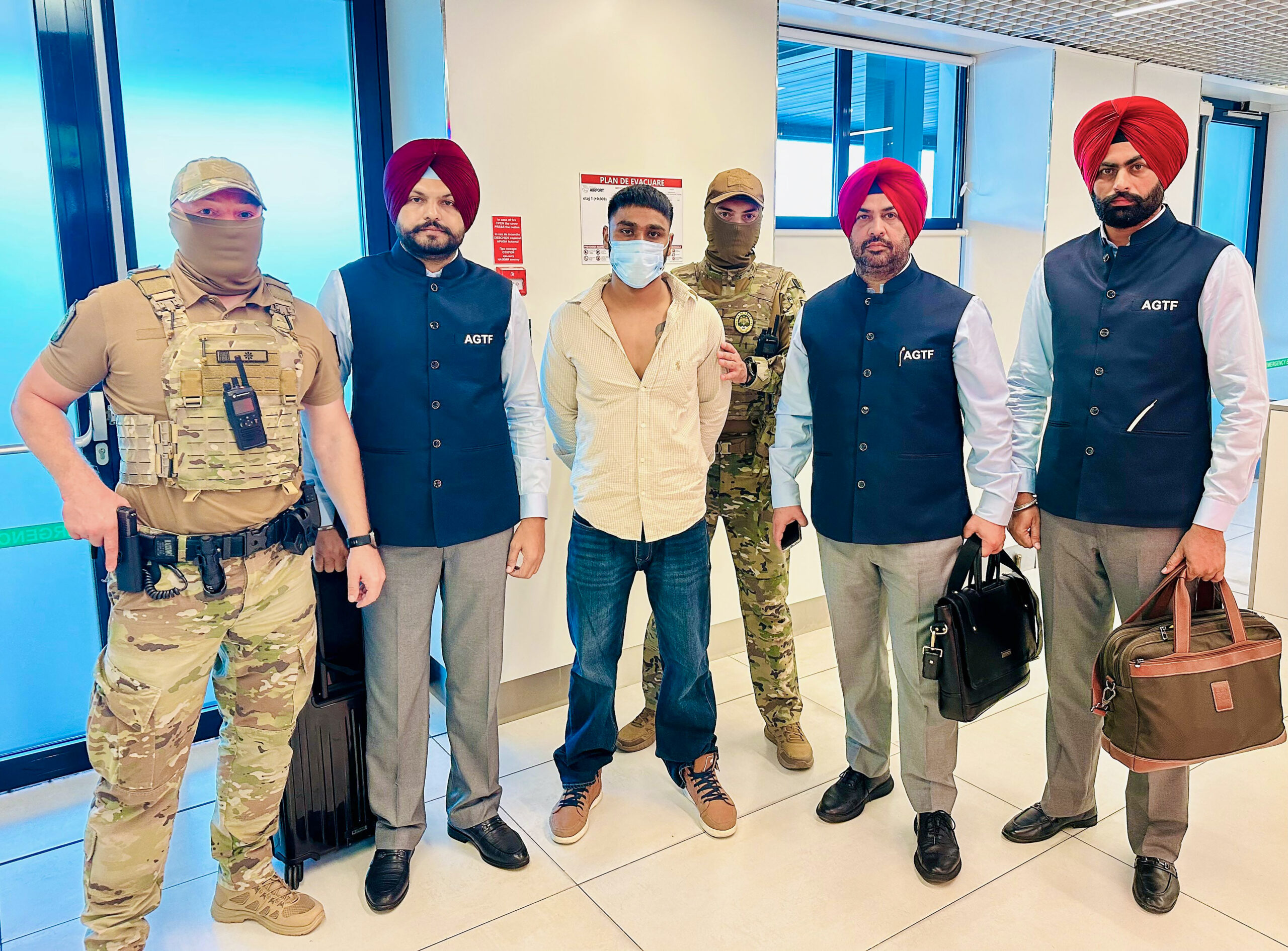 Chandigarh: Punjab Police brings back fugitive criminal Amritpal Singh alias Amrit Dalam, a key operative of the Jaggu Bhagwanpuria Gang, following his extradition from Moldova to India, marking the force's first-ever extradition from a European country. (Photo: IANS/Anti Gangster Task Force Punjab)