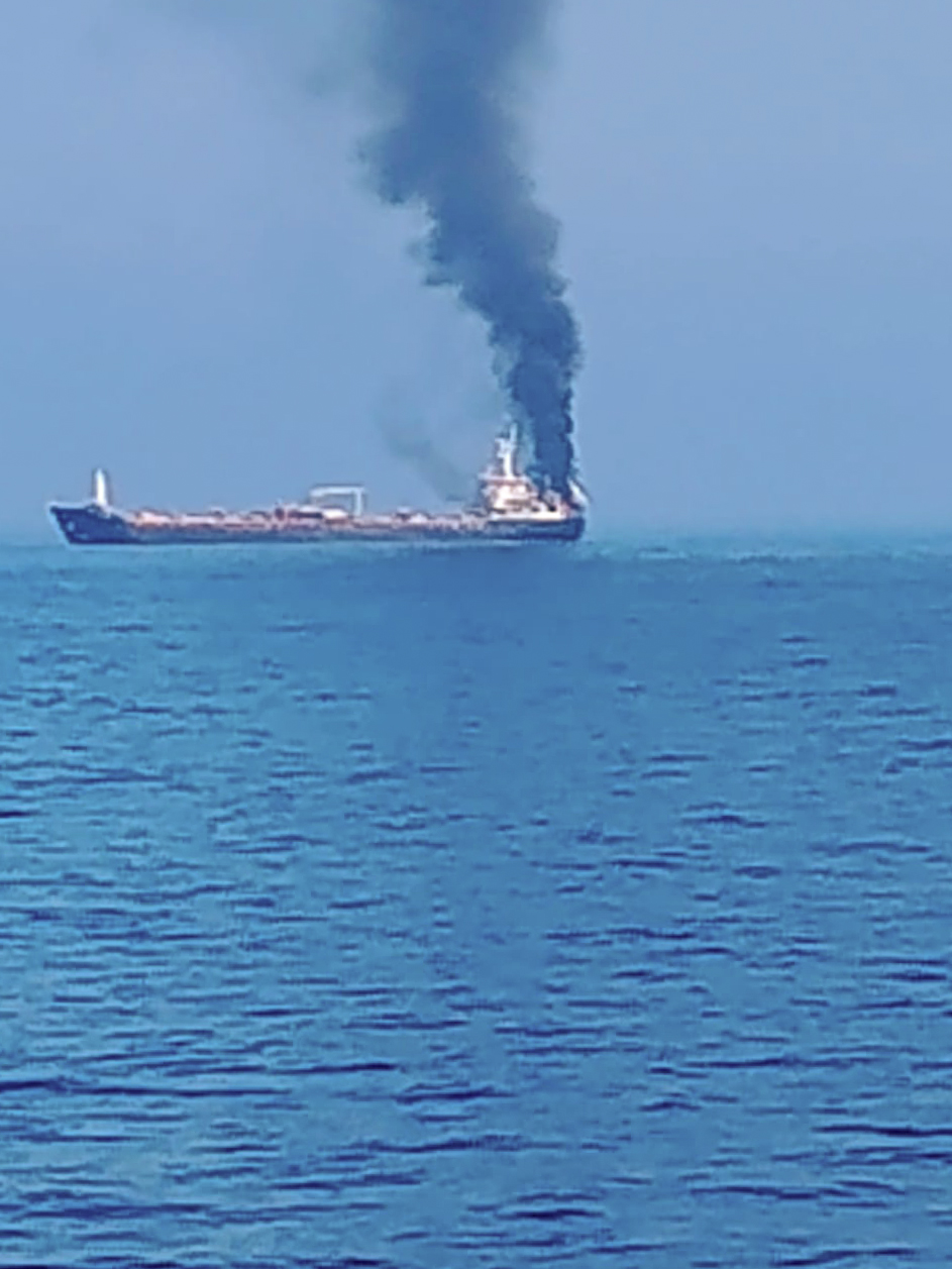 Oman Coast: Smoke billows from the merchant vessel MT Jalveer after it caught fire following an incident near the Omani port of Shinas on Thursday, June 11, 2026. Around 20 Indian crew members were reported to be on board and evacuation operations were underway. (Photo: Screen grab/FSUI)