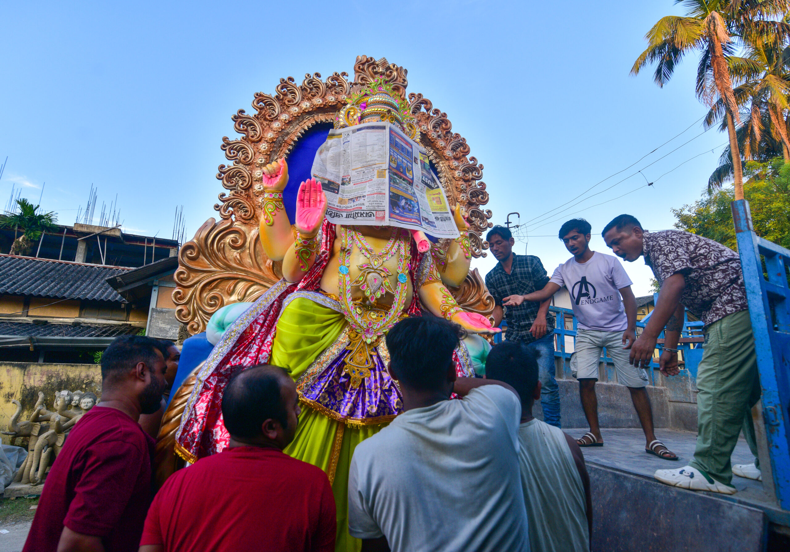 Nagaon: Workers Carry Ganesha Idol Ahead of Ganesh Chaturthi #Gallery Nagaon: Workers Carry Ganesha Idol Ahead of Ganesh Chaturthi #Gallery