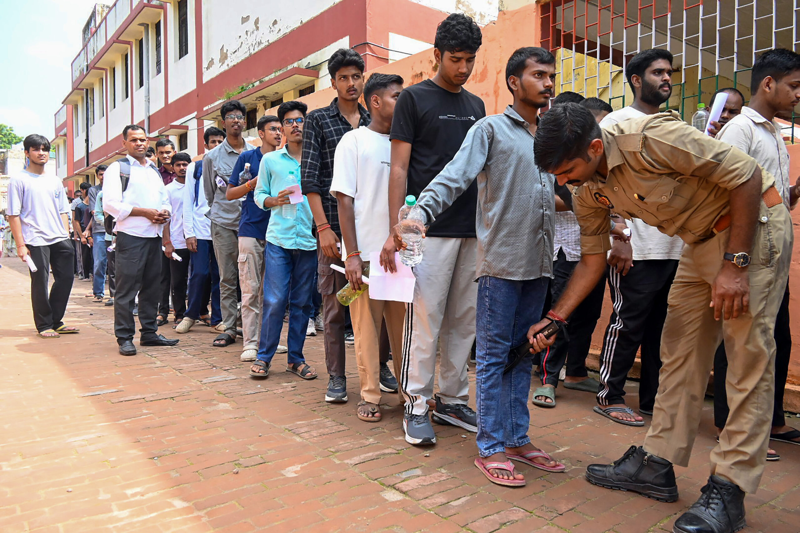 Varanasi: Candidates Undergo Security Checks for NDA Exam #Gallery Varanasi: Candidates Undergo Security Checks for NDA Exam #Gallery