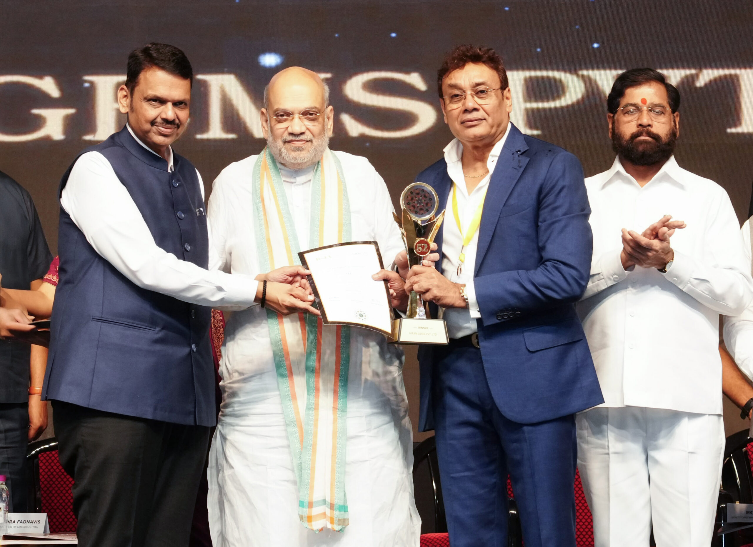 Mumbai: Union Home and Cooperation Minister Amit Shah with Maharashtra Chief Minister Devendra Fadnavis and Deputy Chief Minister Eknath Shinde, presents the 52nd India Gems & Jewellery Awards in Mumbai on Sunday, September 13, 2026. (Photo: IANS/X/@CMOMaharashtra)