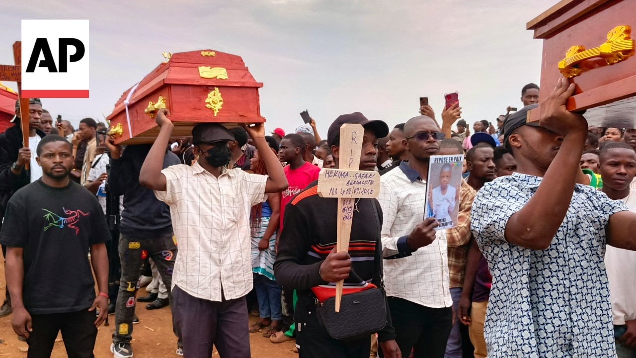 Families bury 27 students killed in school fire in Congo (Video) Families bury 27 students killed in school fire in Congo (Video)