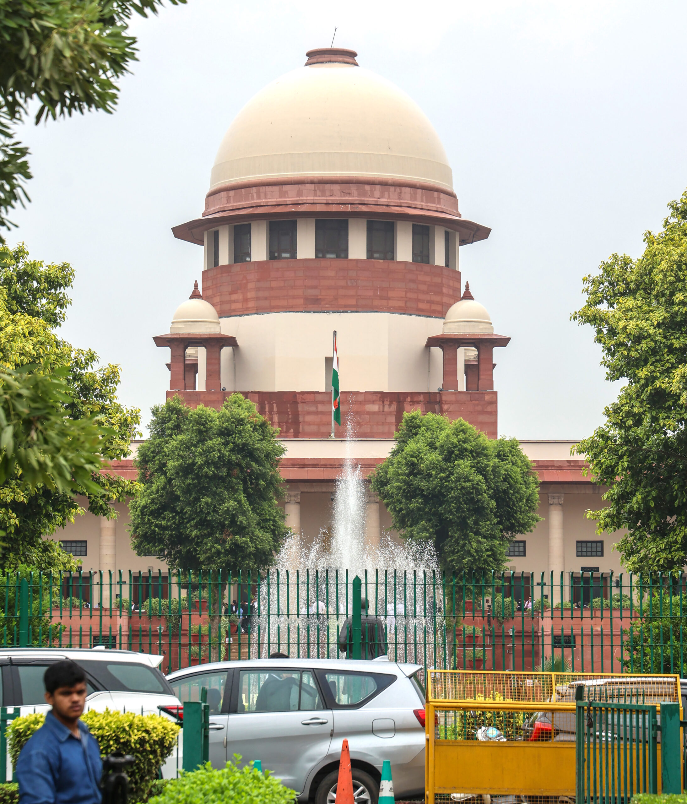 New Delhi: A lawyer walks past the Supreme Court of India amid cloudy weather in New Delhi on Monday, October 6, 2025. (Photo: IANS/Prem Nath Pandey)