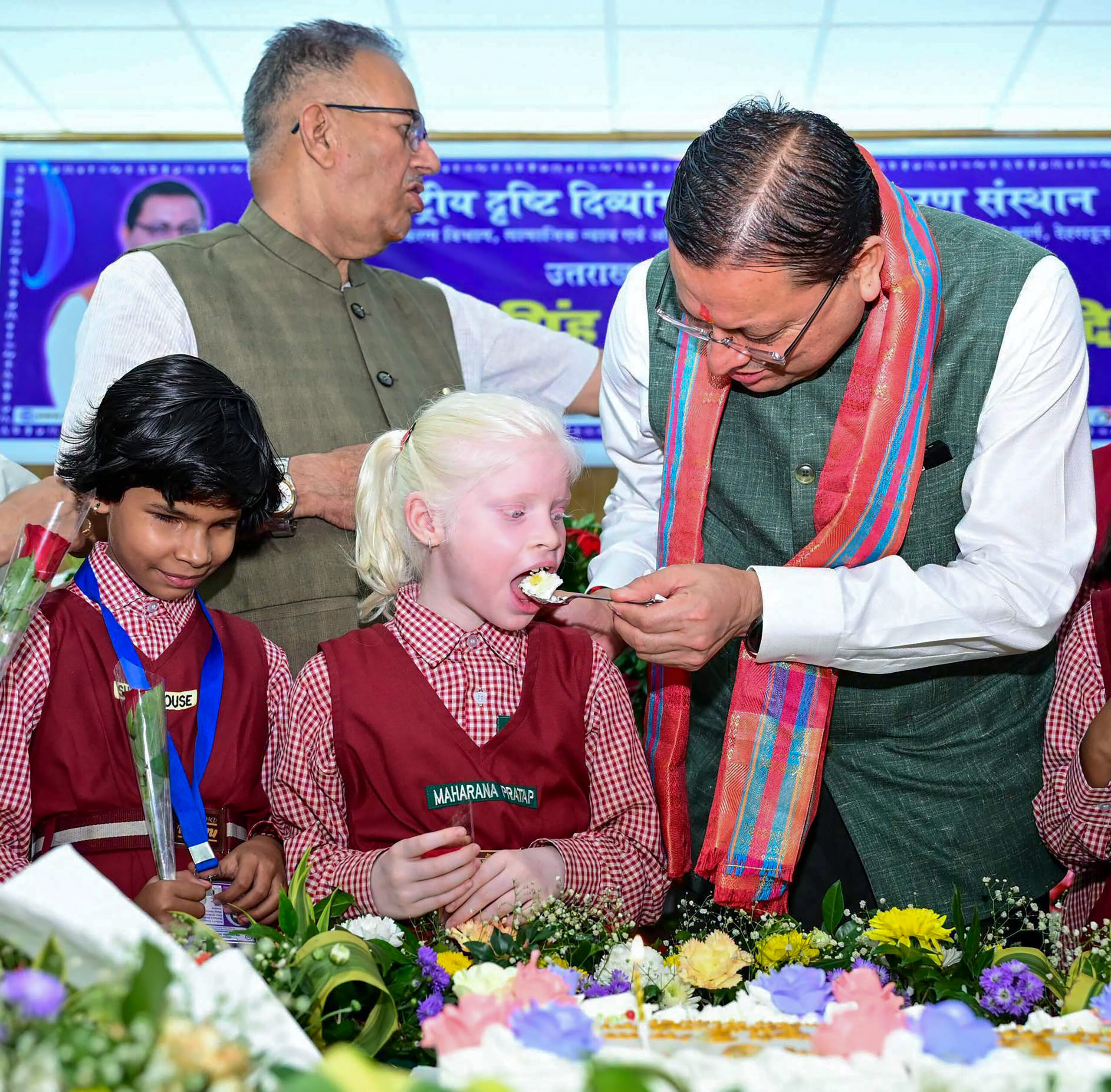 Dehradun: Uttarakhand Chief Minister Pushkar Singh Dhami celebrates his birthday with children studying at the National Institute for Empowerment of Persons with Visual Disabilities, in Dehradun, Uttarakhand, on Wednesday, September 16, 2026. (Photo: IANS/X/@DIPR_UK)