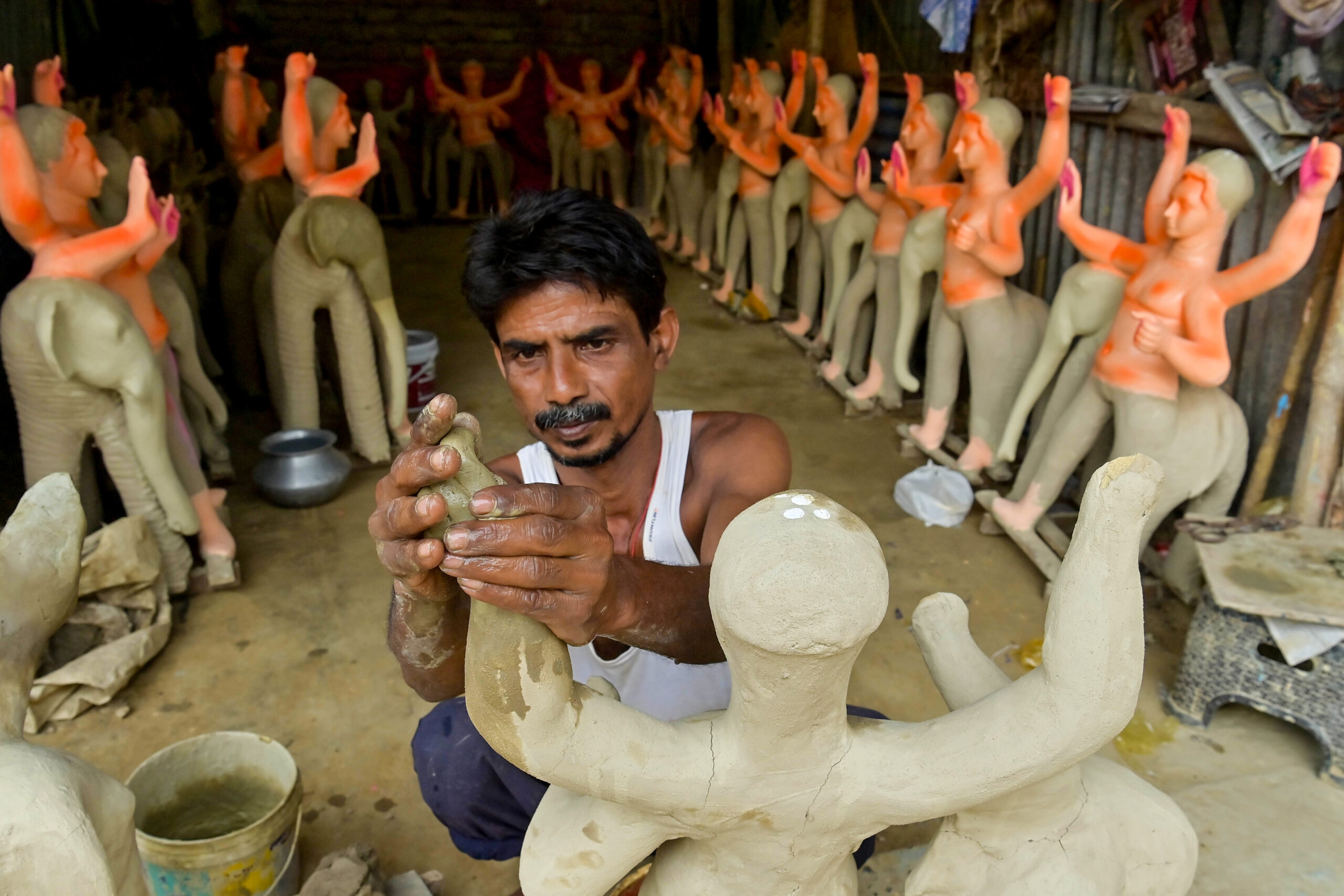 Agartala: Idol makers give finishing touches to Vishwakarma idols #Gallery Agartala: Idol makers give finishing touches to Vishwakarma idols #Gallery