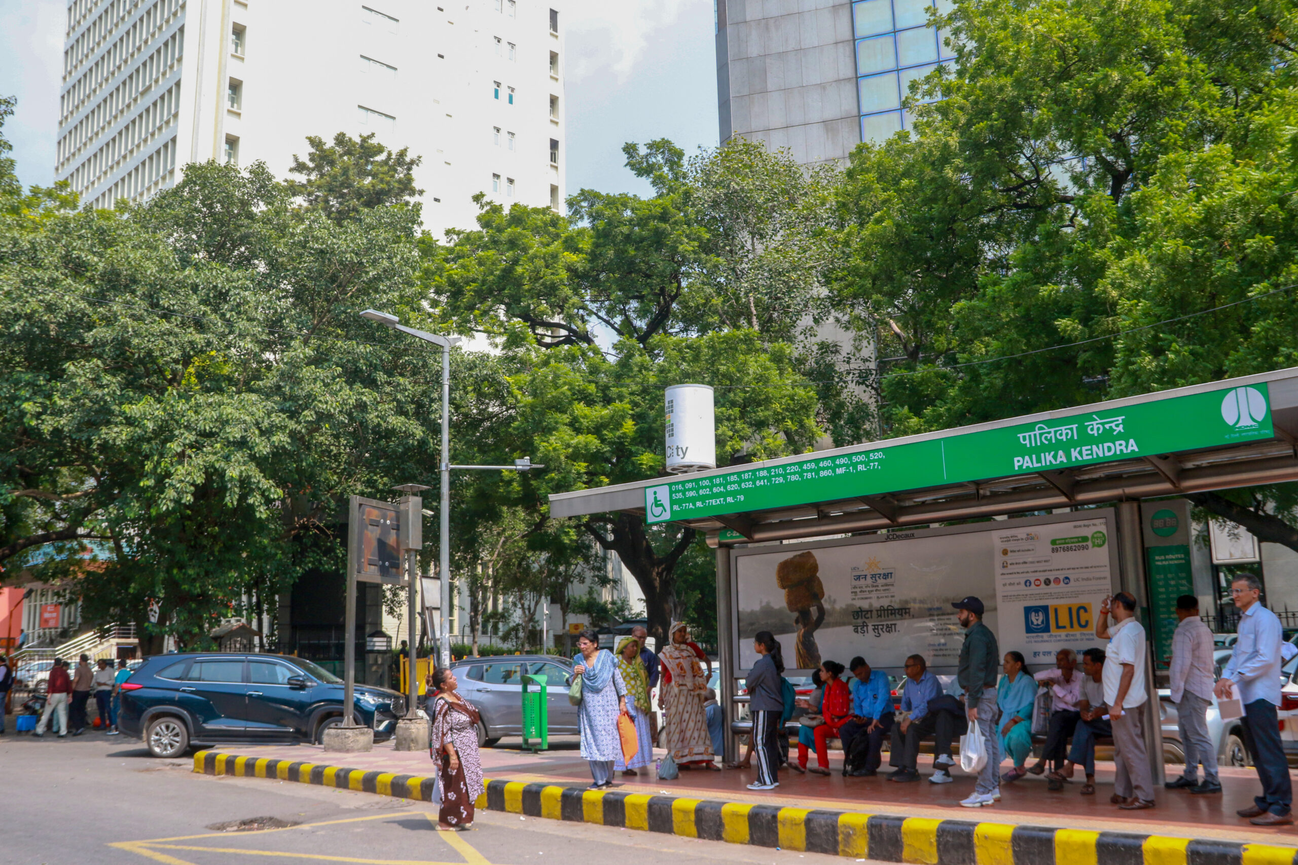 New Delhi: Passengers wait with their luggage at a bus stop as the ongoing DTC drivers strike disrupts bus services in New Delhi on Wednesday, September 16, 2026. (Photo: IANS/Qamar Sibtain)