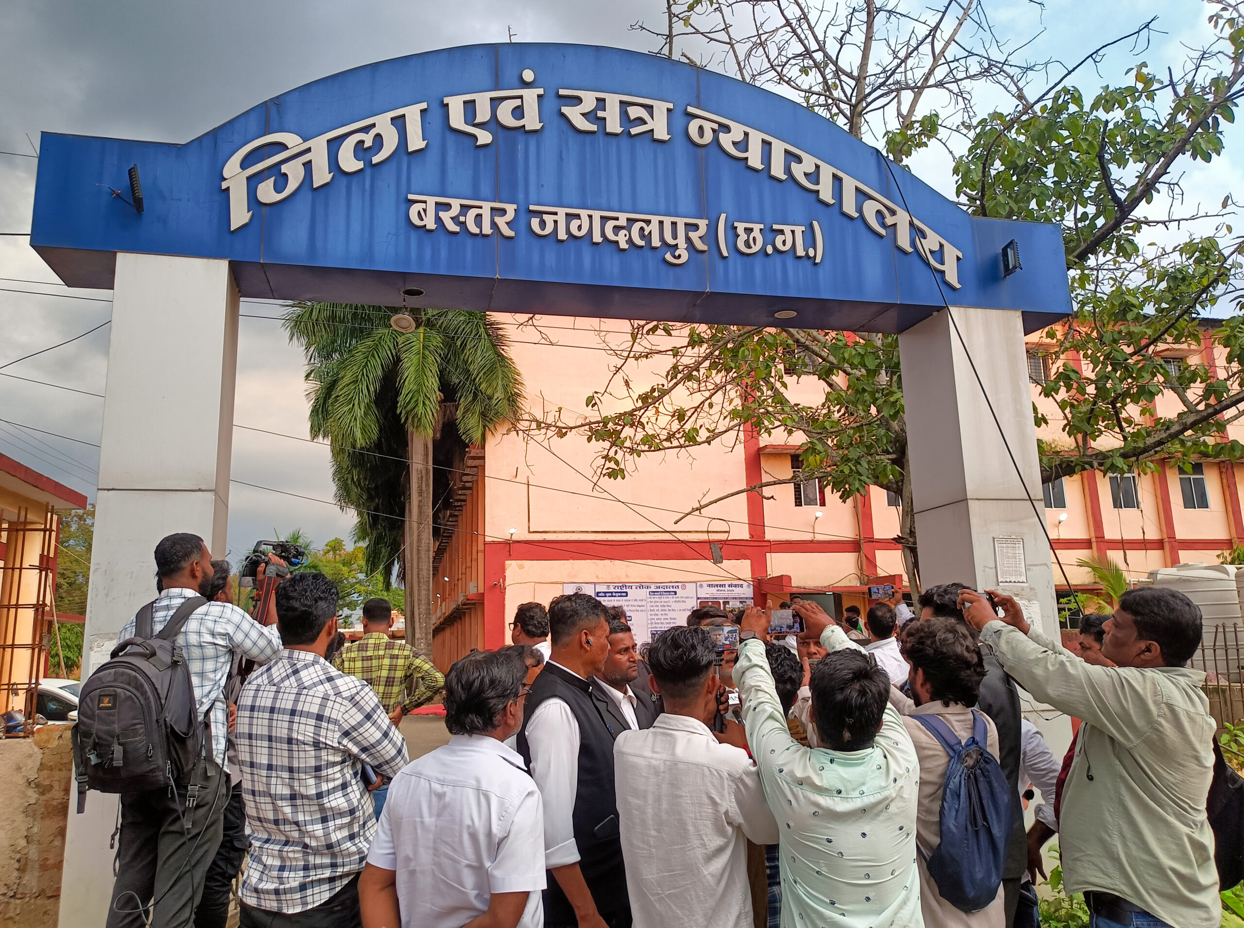 Bastar : Media persons and people gather outside the District and Sessions Court after a Special NIA Court sentenced 10 Maoist convicts to death in connection with the 2013 Jhiram Ghati attack, in Jagdalpur, Bastar district of Chhattisgarh on Wednesday, September 16, 2026. (Photo: IANS)