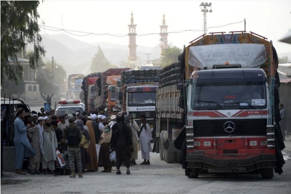 Photo taken on Sept. 3, 2021 shows trucks waiting to enter Pakistan at the border crossing point of Torkham between Pakistan and Afghanistan. (Xinhua/Ahmad Kamal/IANS)