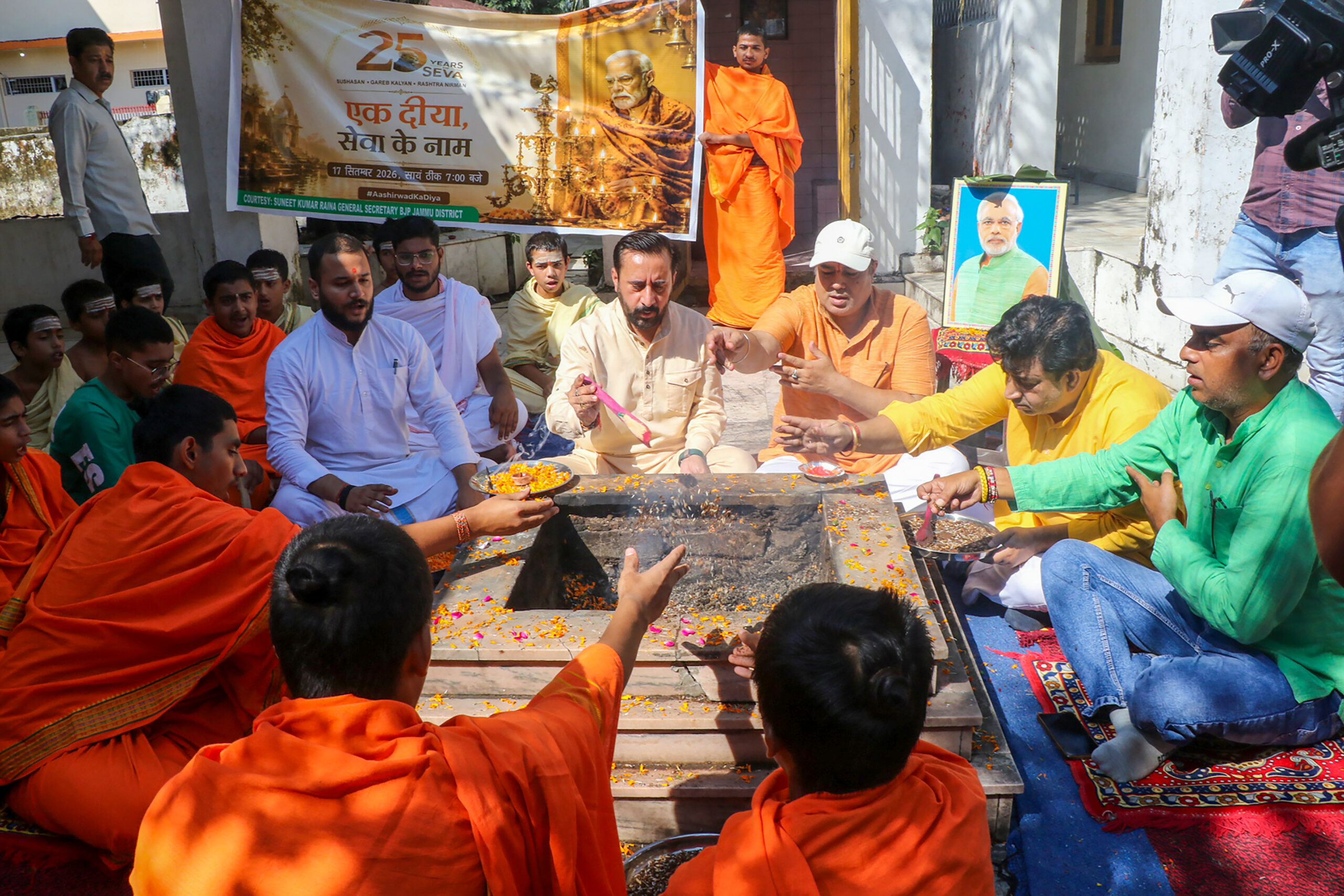 Jammu: BJP workers perform Havan on PM Modi's birthday #Gallery Jammu: BJP workers perform Havan on PM Modi's birthday #Gallery