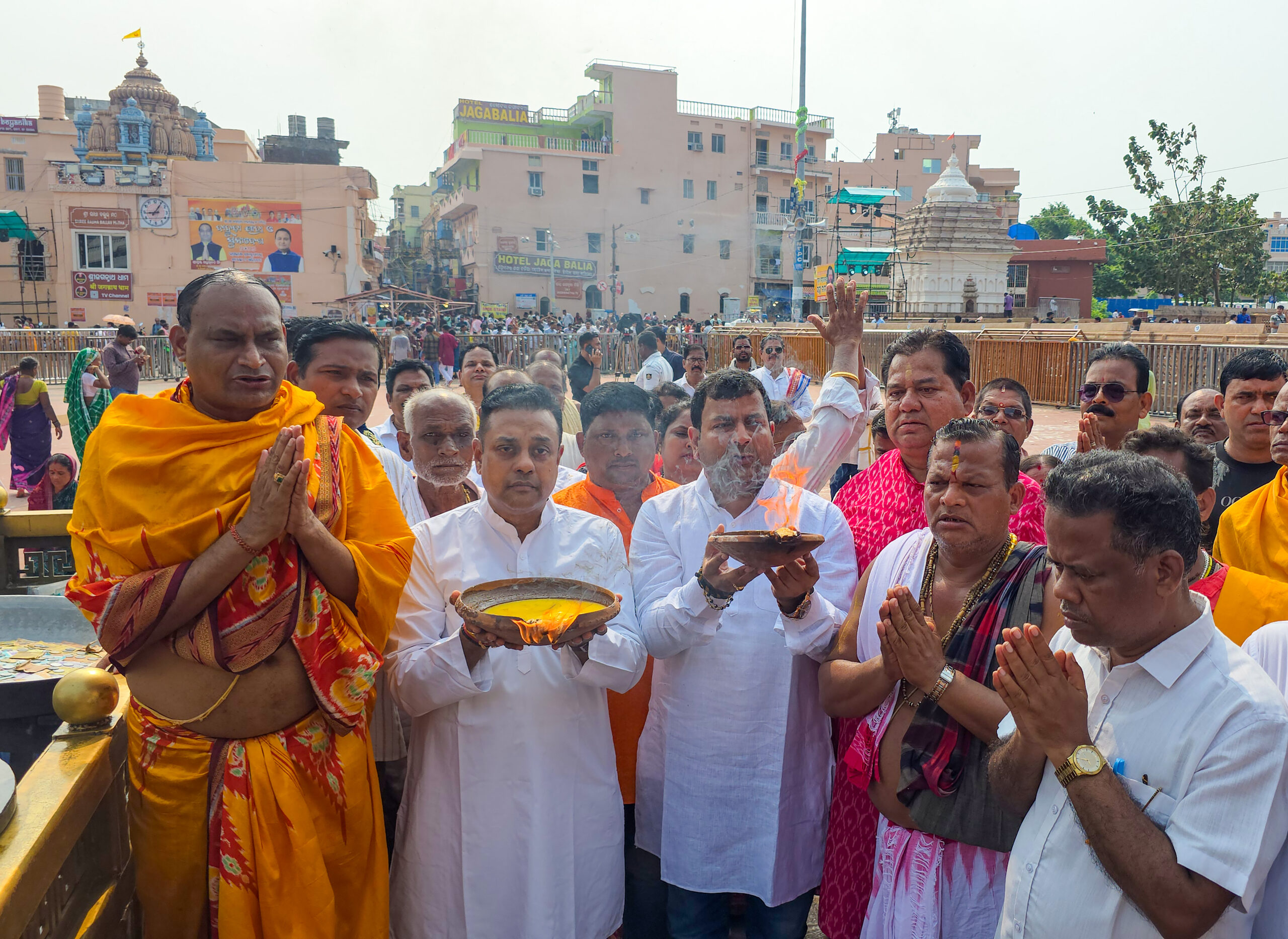 Puri: BJP MP Sambit Patra and party workers perform collective Deepdaan (lamp lighting) in front of the Shree Jagannath Temple on the occasion of Prime Minister Narendra Modi's 76th birthday, in Puri district of Odisha on Thursday, September 17, 2026. (Photo: IANS)