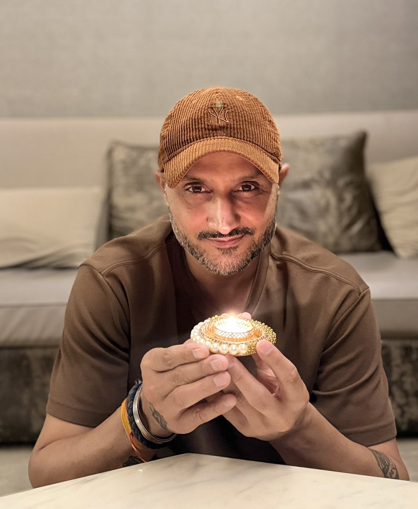 New Delhi: Harbhajan Singh lights diya on PM Modi’s birthday #Gallery New Delhi: Harbhajan Singh lights diya on PM Modi’s birthday #Gallery