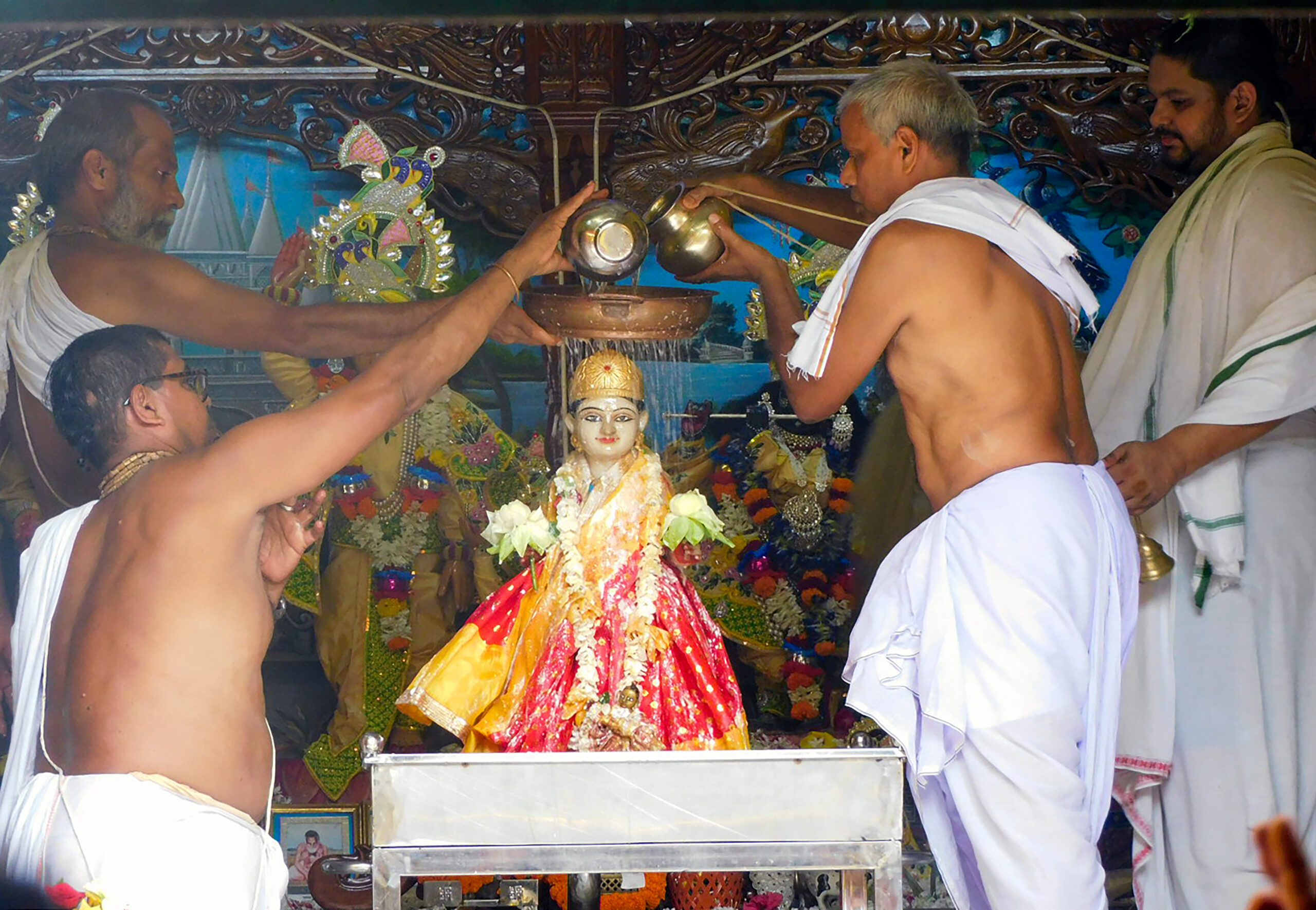 Bankura: Priests perform 'Jalabhishek' of Goddess Radha on Radha Ashtami at Keshyakol Gaudiya Math in Bankura district of West Bengal on Saturday, September 19, 2026. (Photo: IANS)