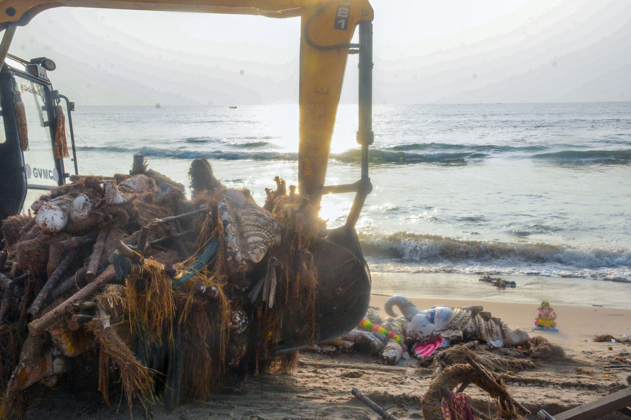 Visakhapatnam: GVMC workers clean puja items and the remains of Ganesh idols from the shore after the seventh day of Ganesh immersion, in Visakhapatnam on Sunday, September 20, 2026. (Photo: IANS)