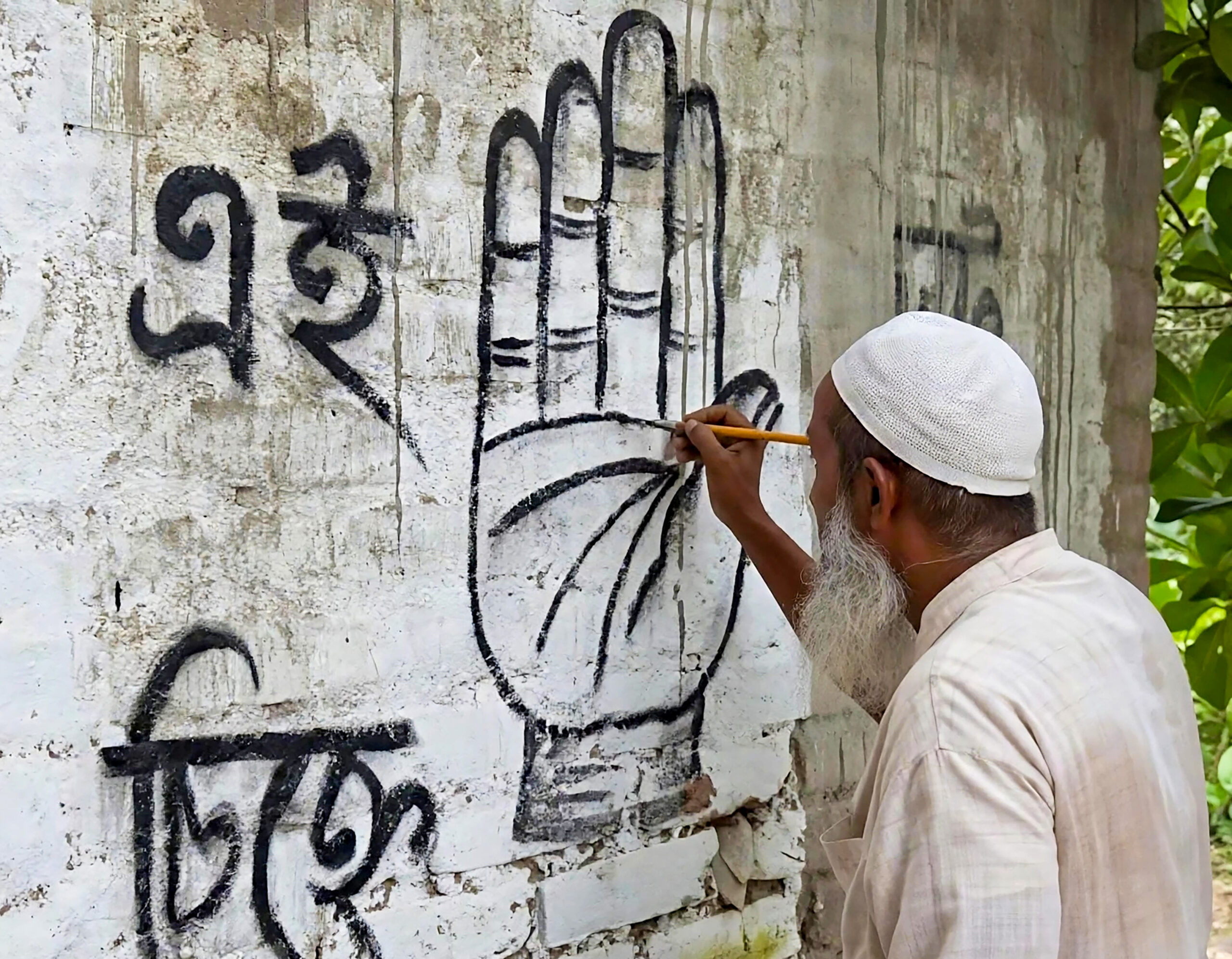Nandigram: Congress supporter paints party symbol #Gallery Nandigram: Congress supporter paints party symbol #Gallery