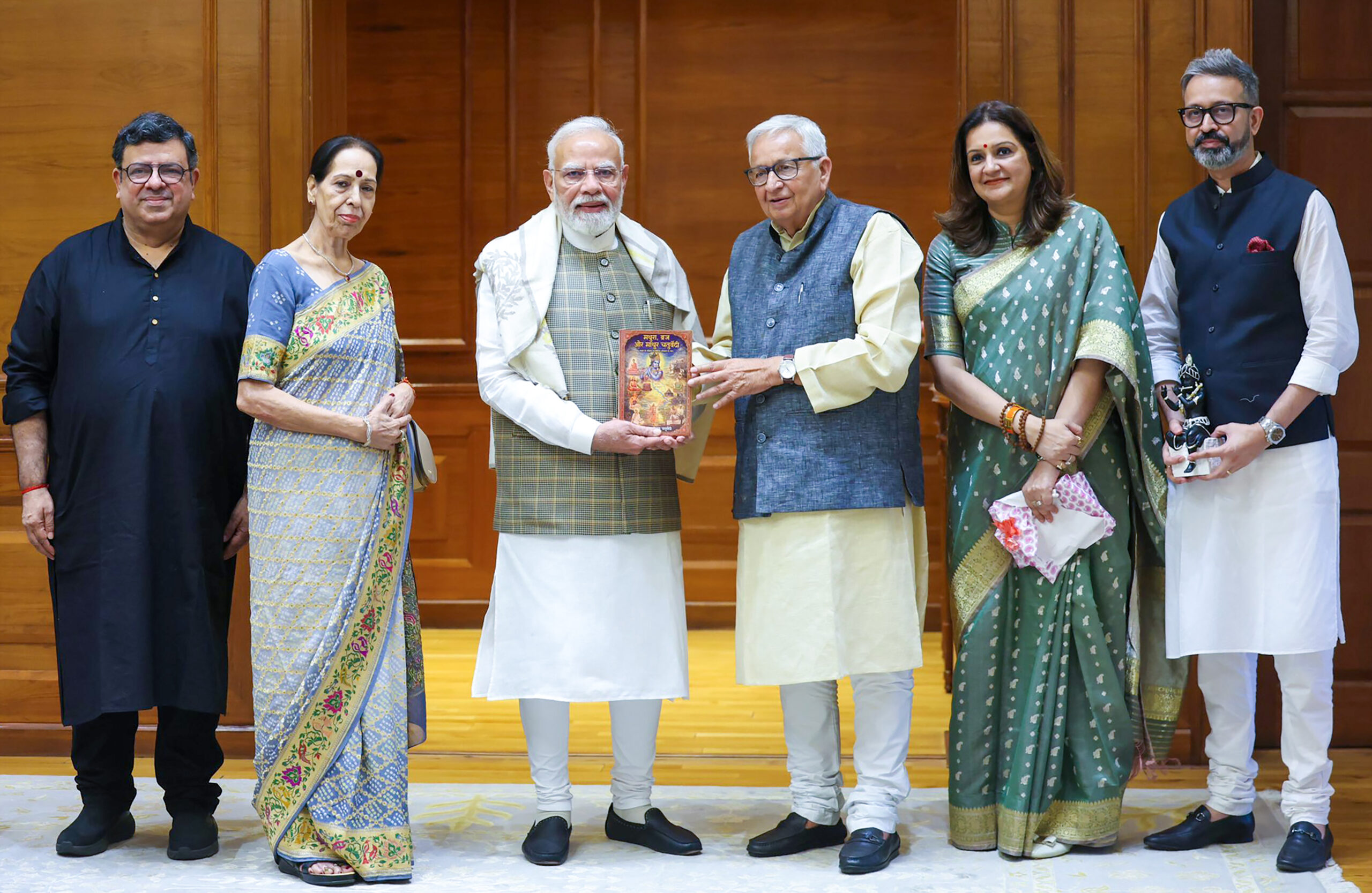New Delhi: PM Modi Receives Book on Braj from Priyanka Chaturvedi's Father #Gallery New Delhi: PM Modi Receives Book on Braj from Priyanka Chaturvedi's Father #Gallery