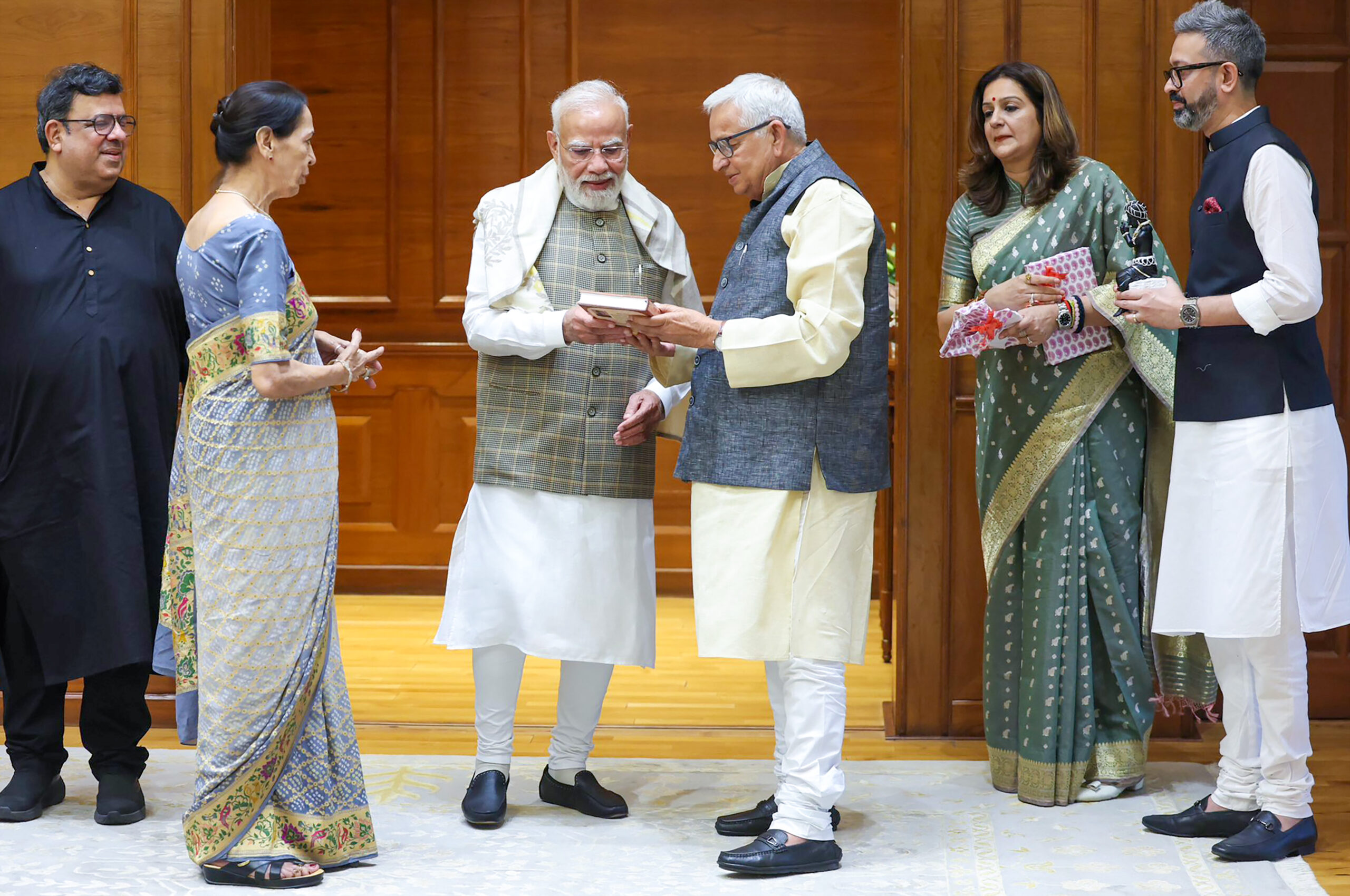 New Delhi: PM Modi Receives Book on Braj from Priyanka Chaturvedi's Father #Gallery New Delhi: PM Modi Receives Book on Braj from Priyanka Chaturvedi's Father #Gallery