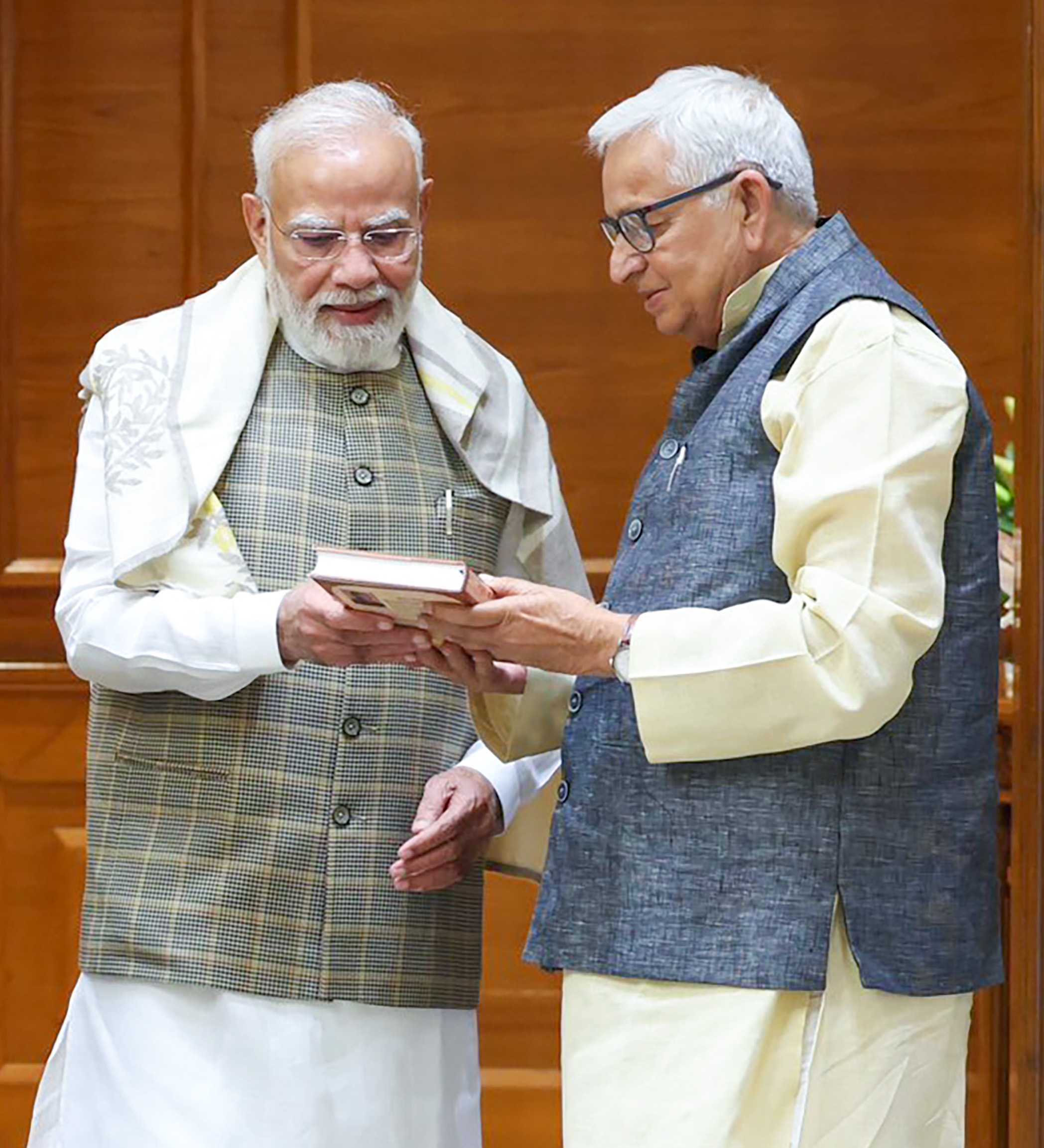 New Delhi: PM Modi Receives Book on Braj from Priyanka Chaturvedi's Father #Gallery New Delhi: PM Modi Receives Book on Braj from Priyanka Chaturvedi's Father #Gallery