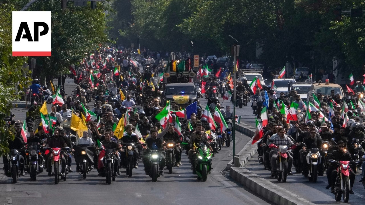 Thousands of government supporters stage a motorcycle rally in Iran (Video)