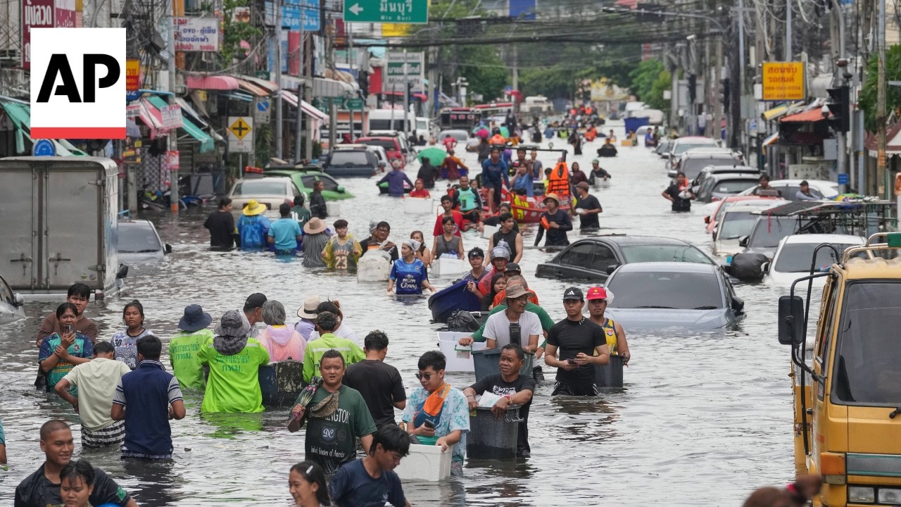 Residents navigate the flooded streets in Bangkok after days of rain (Video)