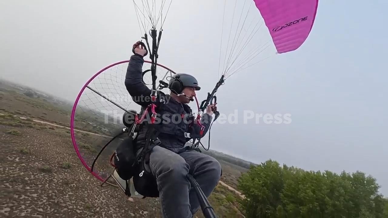 Air traffic controller straps on paramotor to fly to work (Video)