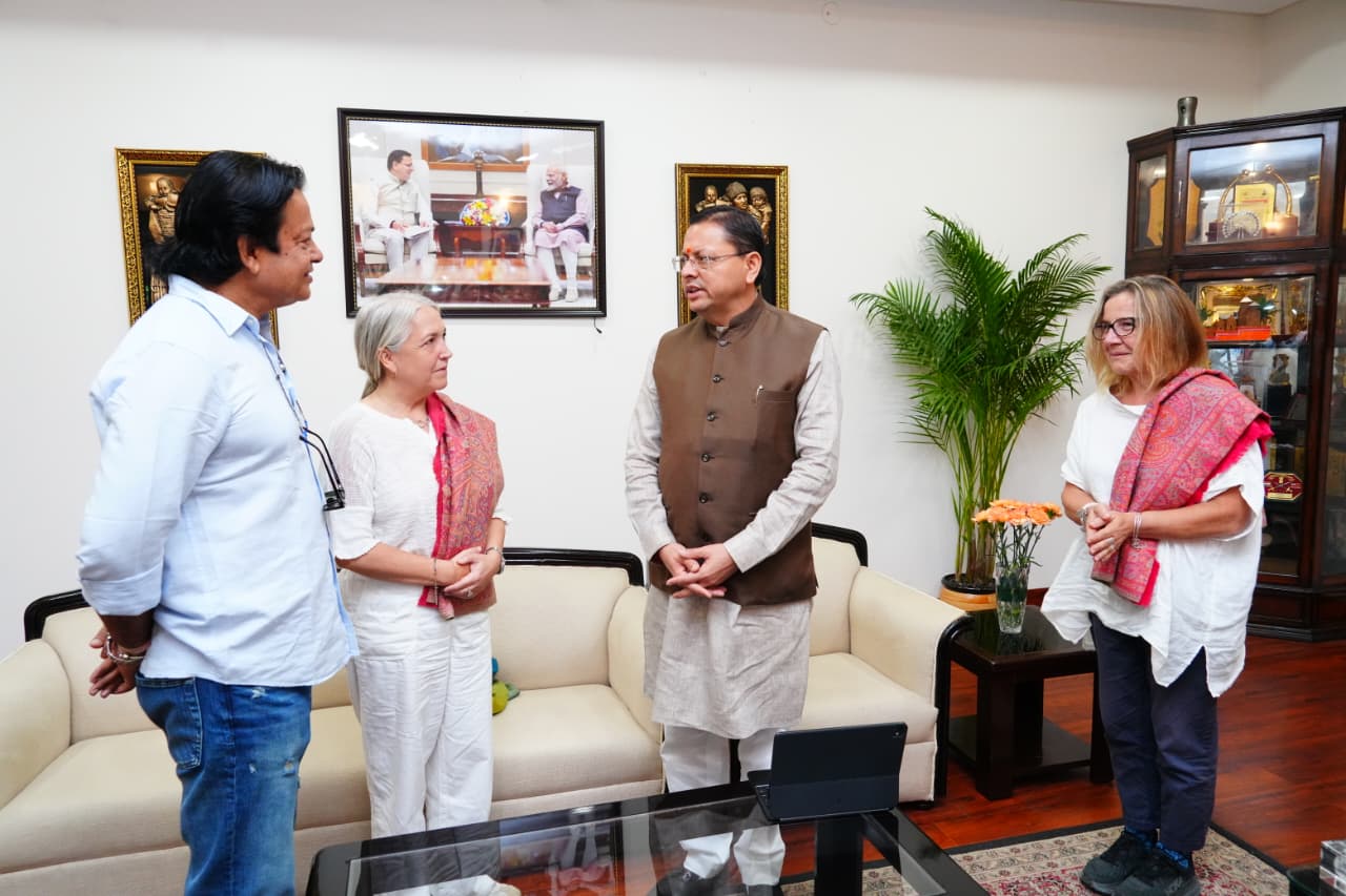 International filmmakers meet U'khand CM Dhami, discuss 'The Beatles' project