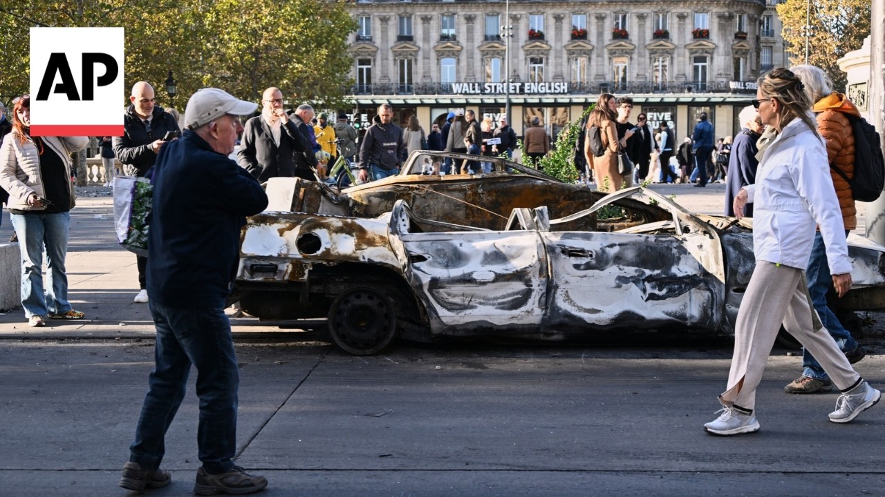 Paris residents survey the damage after clashes and looting during protests (Video)